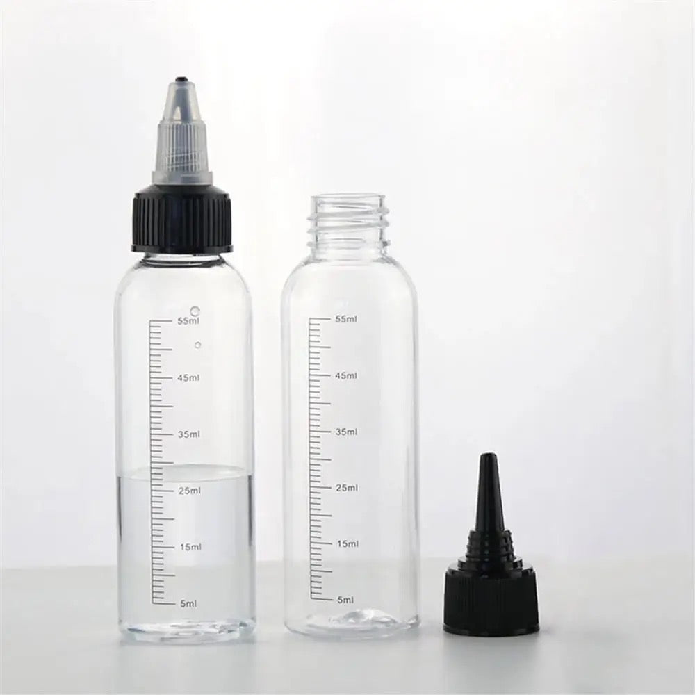 Clear refillable bottle with twist nozzle cap