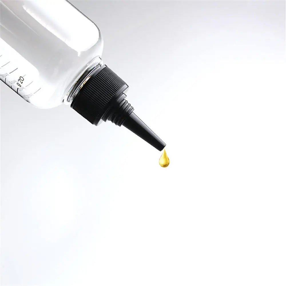 Nozzle tip pouring a drop